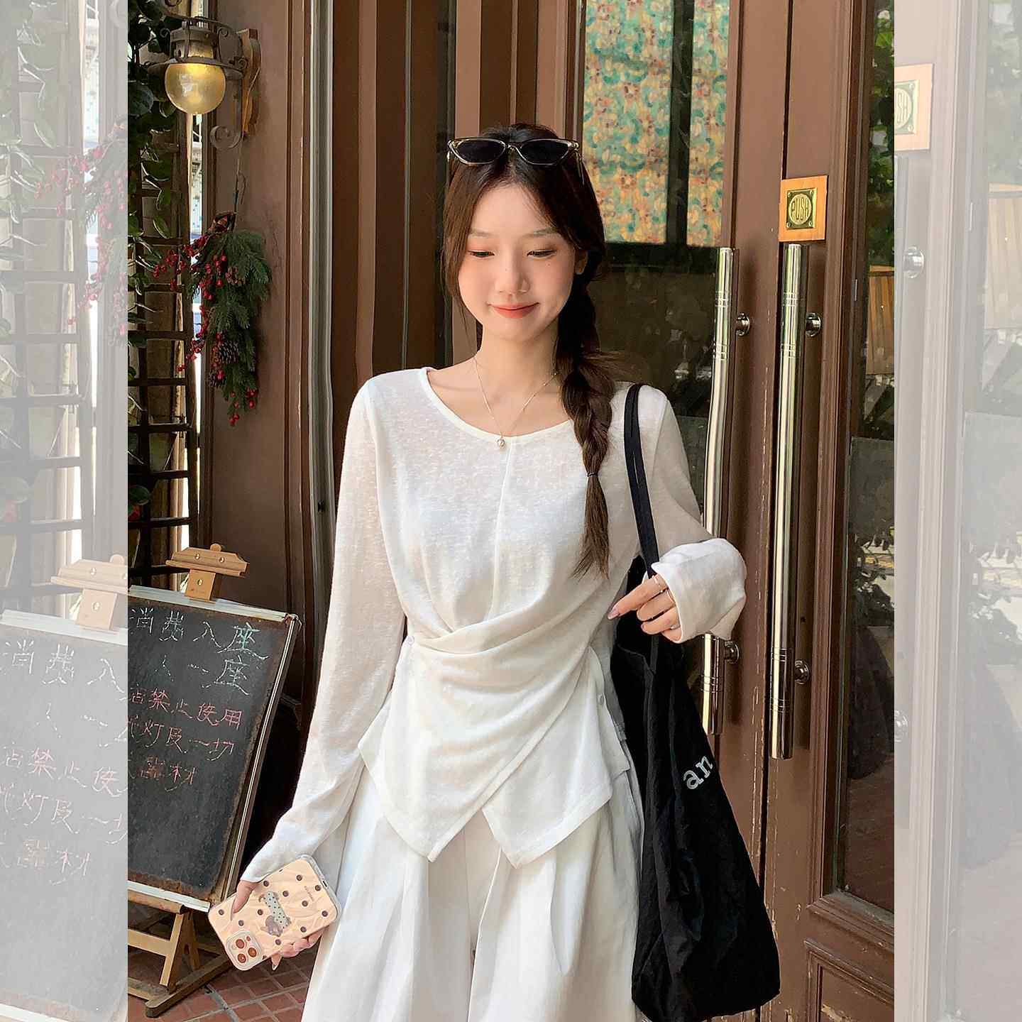 广州潮牌美衣服饰制衣有限公司白色不规则交叉薄款微透防晒罩衫t
