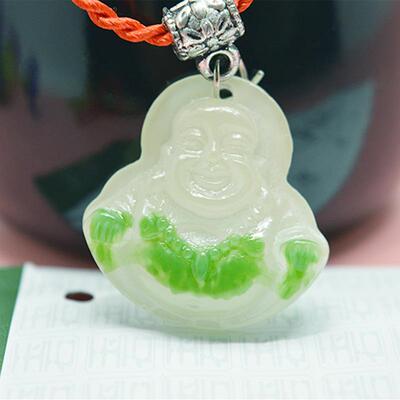 Street vendor sourced jade and resin Buddha pendants, Maitre