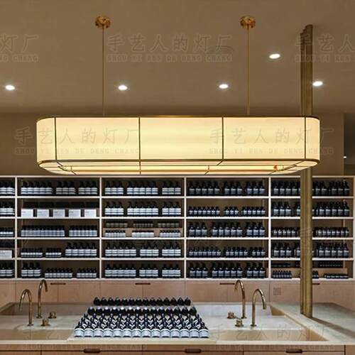 酒店中餐厅椭圆形吊灯自助茶餐厅饭店收银台岛台餐桌米色布艺吊灯