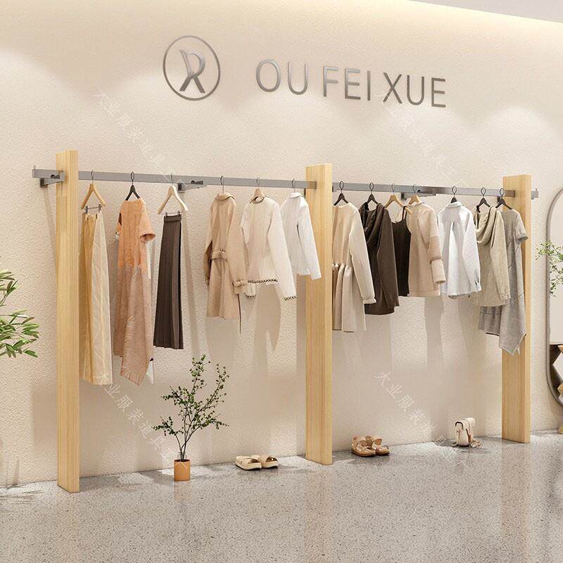 高端女装店上墙展示架实木服装店货架不锈钢新款服装挂衣架定制