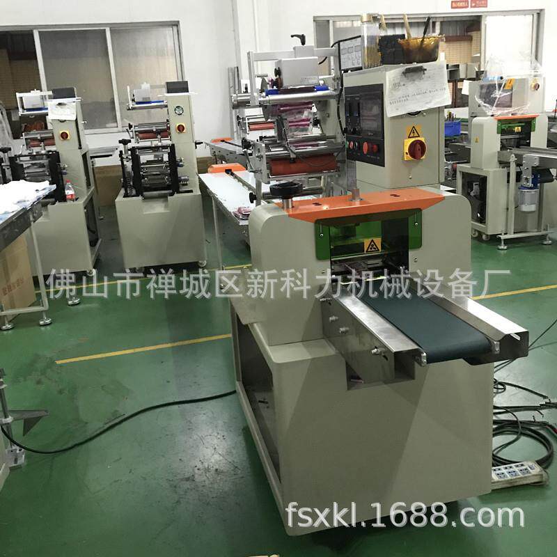 手机贴膜工具包装机枕式日用品自动包装机除尘贴干湿包套袋机
