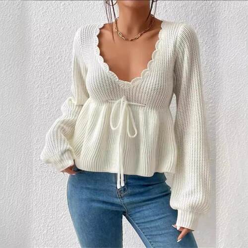 Knitted pullover sweater with drawstring tie and ruffle