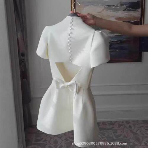 Half high neck short sleeved cinched ivory white dress
