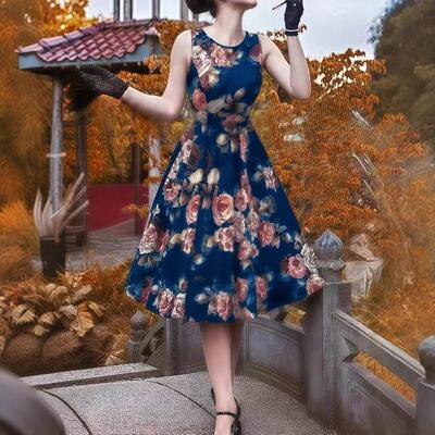 Female style sleeveless printed mid length dress with a