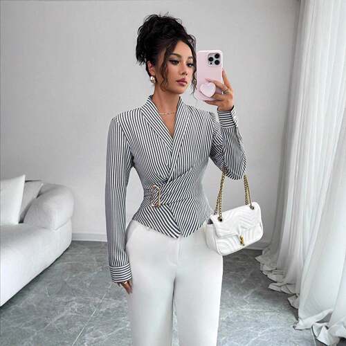 A women's black and white fashionable striped waist cinched