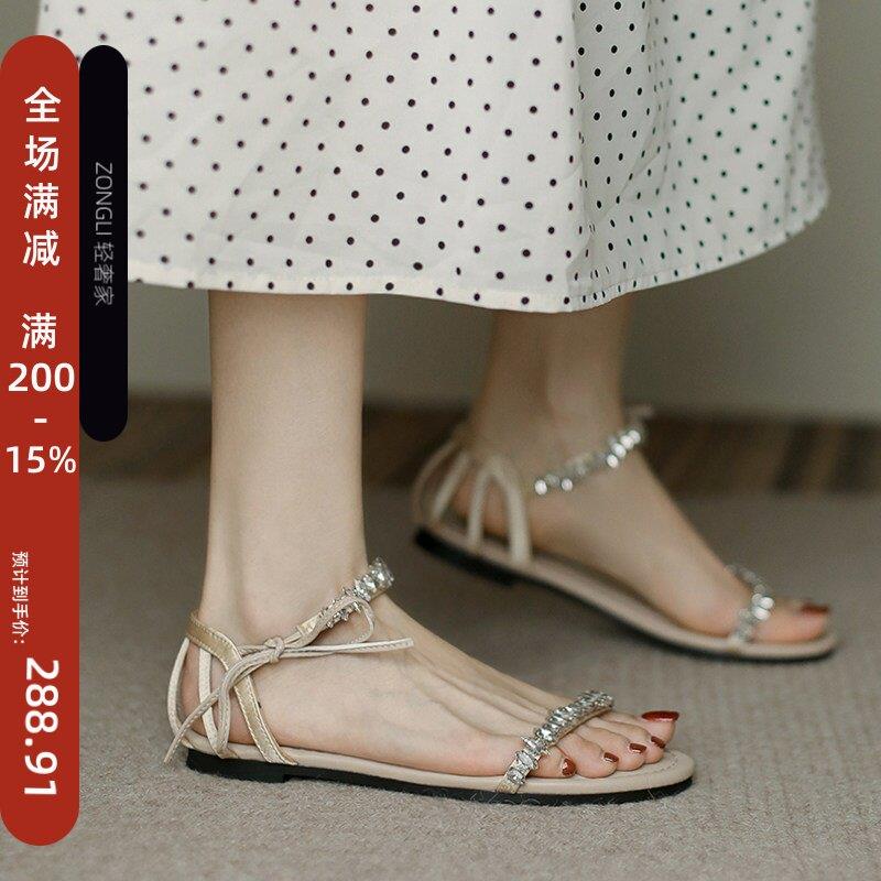 香港水钻平底凉鞋女夏季2026新款一字带气质仙女风绑带露趾罗马鞋