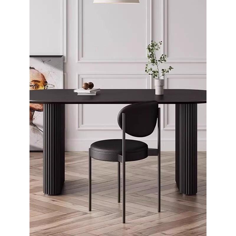 高档欧轻奢实木餐桌黑色椭长圆形家用桌北代简约洽谈桌现设计师办