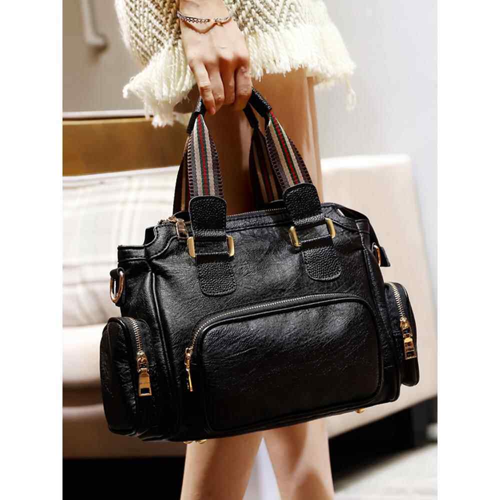 香港袋2025新枕头肩斜挎包女士时尚容易匹配便携式大容量真皮波士