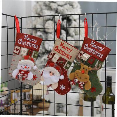 Santa Claus snowman figure Christmas stocking hanging