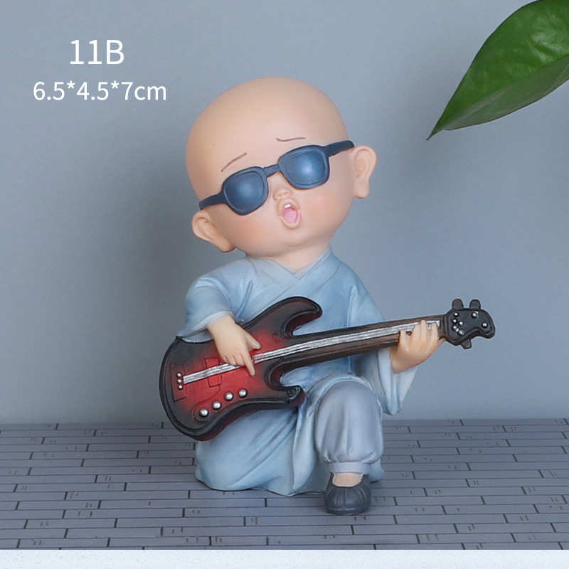 饰品车头创意香薰摆件和尚车载汽车装饰乐队车上小个性中控台摆件