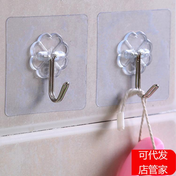 Behind the transparent door, adhesive hooks for the kitchen