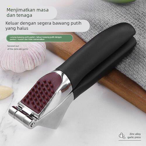 Zinc alloy manual garlic press, thickened for household use.