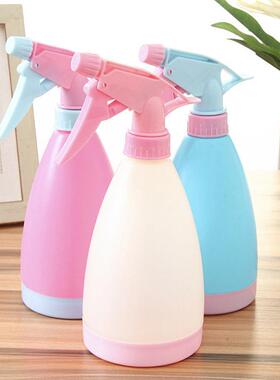 Candy-colored hand-press watering can, a gardening tool for