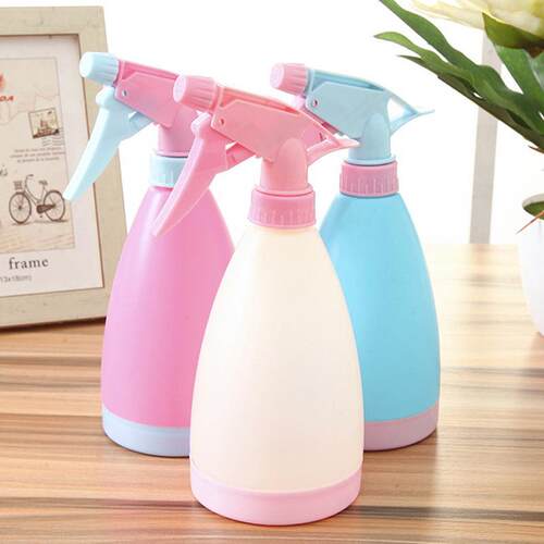 Candy-colored hand-press watering can, a gardening tool for