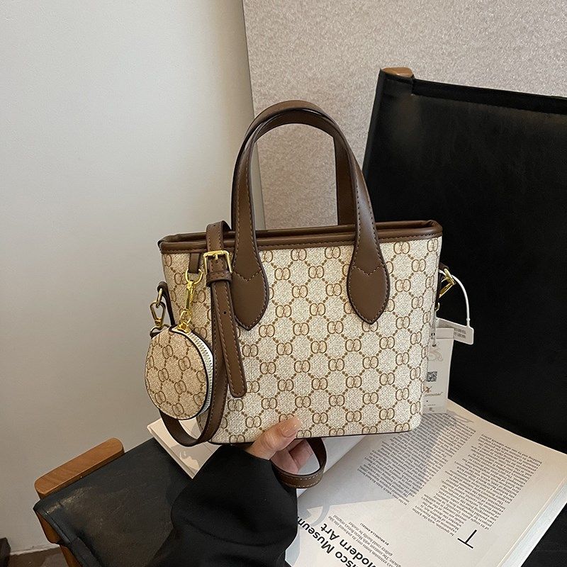 今年流行水桶菜篮子包包女2025新款斜跨小包印花质感单肩手提女包,箱包皮具/热销女包/男包,水桶包,淘宝优惠券,粉丝福利购,淘宝优惠卷