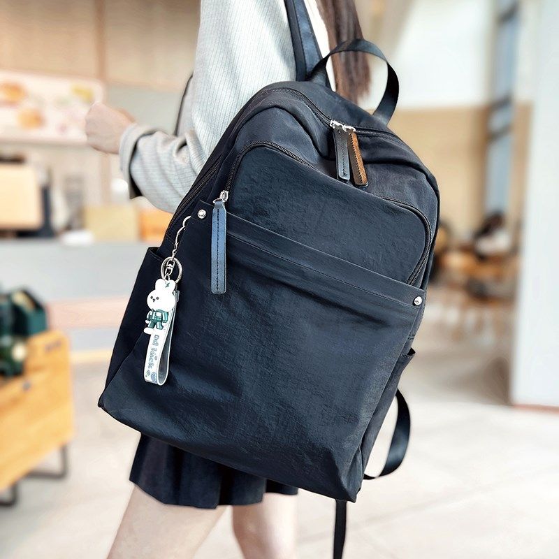 帆布双肩包女2025新款大容量轻便旅游背包户外防水百搭休闲牛津包