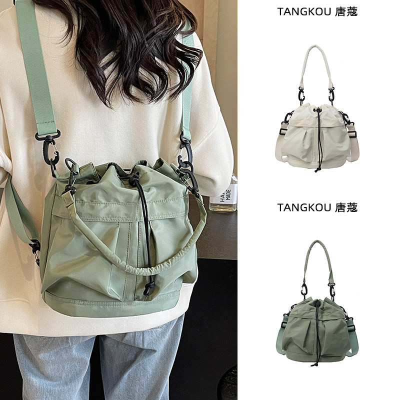双肩斜挎两用包包女士2024新款轻便旅行抽绳背包休闲尼龙水桶布包,箱包皮具/热销女包/男包,通用款女包,淘宝优惠券,粉丝福利购,淘宝优惠卷