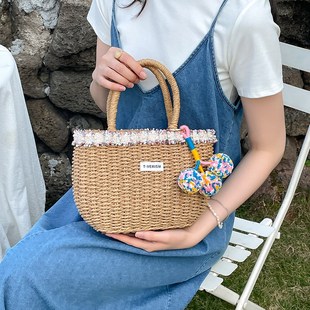 高级感彩色毛球单肩草编包新款花边草包编织包度假沙滩包百搭女包