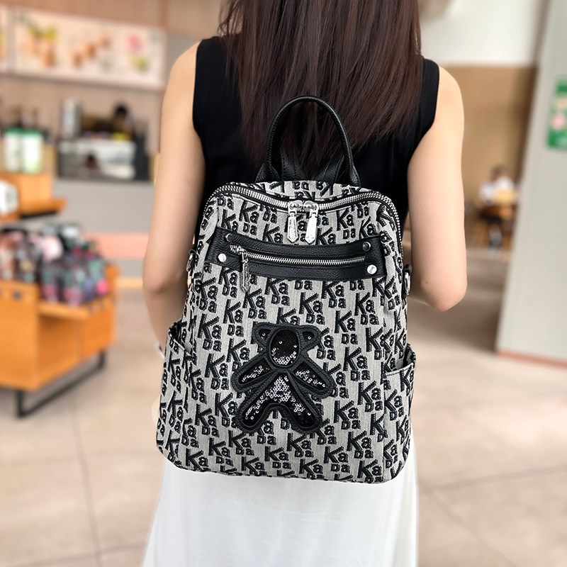 时尚印花帆布双肩包女2024新款休闲百搭小众潮流背包两用单肩女包