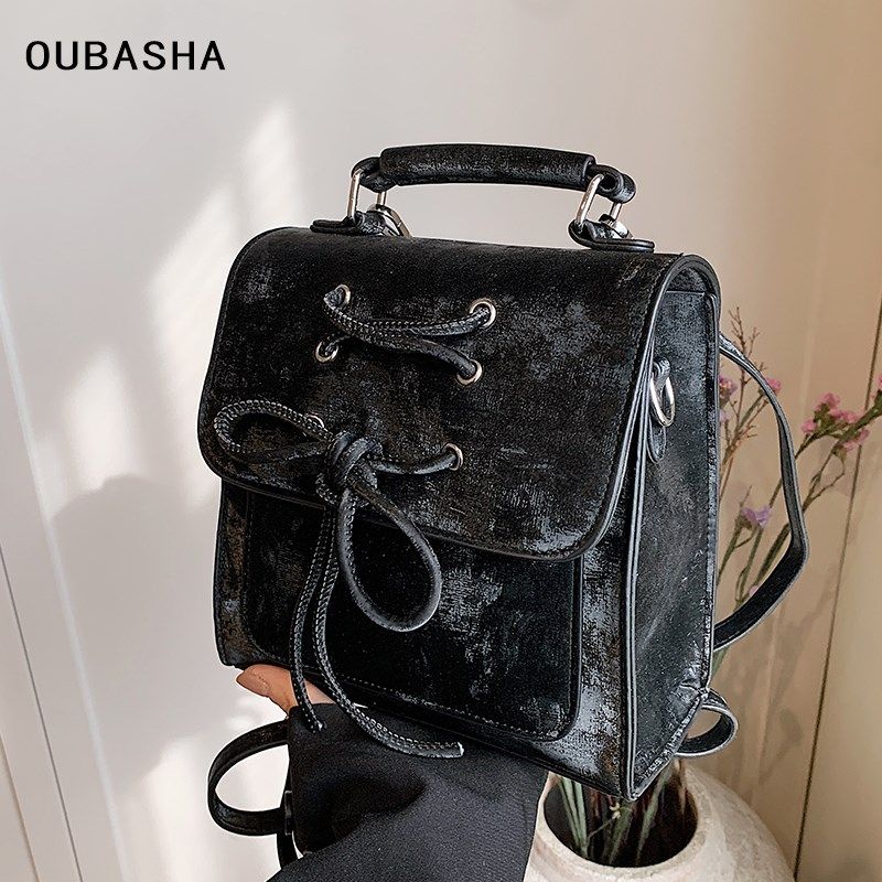 高级感粉色包包女2025新款春夏时尚双肩包小众设计通勤手提小背包