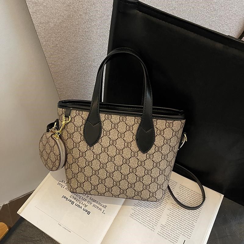 今年流行水桶菜篮子包包女2025新款斜跨小包印花质感单肩手提女包,箱包皮具/热销女包/男包,水桶包,淘宝优惠券,粉丝福利购,淘宝优惠卷