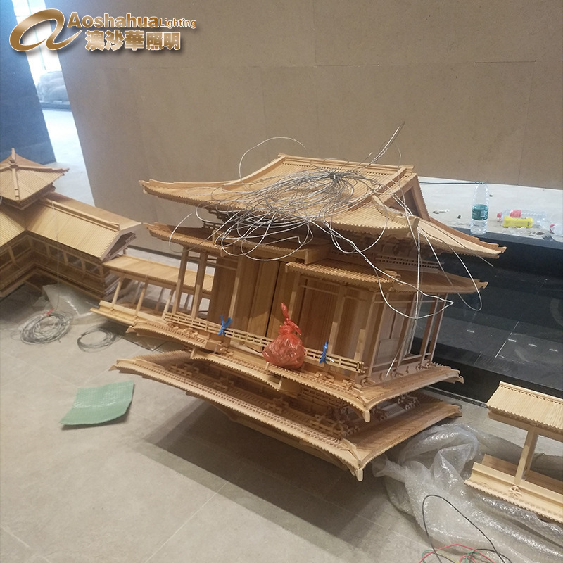非标工程售楼部沙盘灯中庭中空木房子木阁楼木飘带木料吊灯