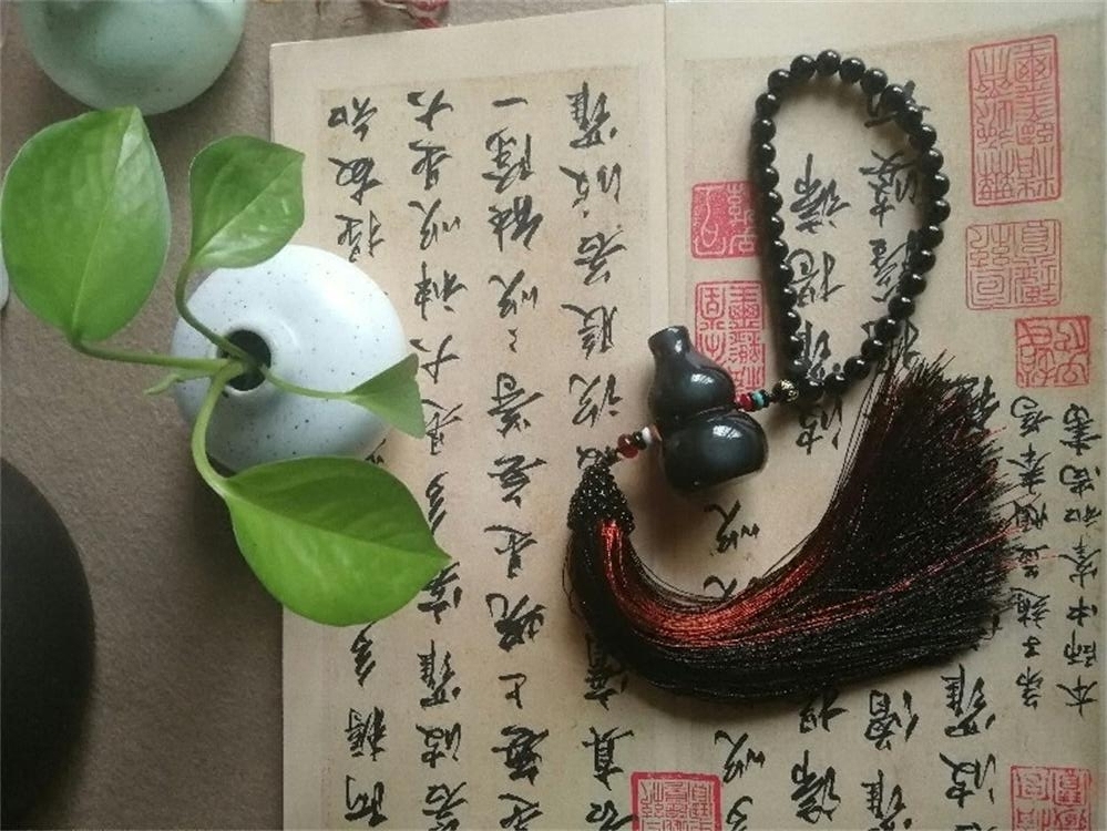 黑曜石手工编织反光镜彩虹眼挂件