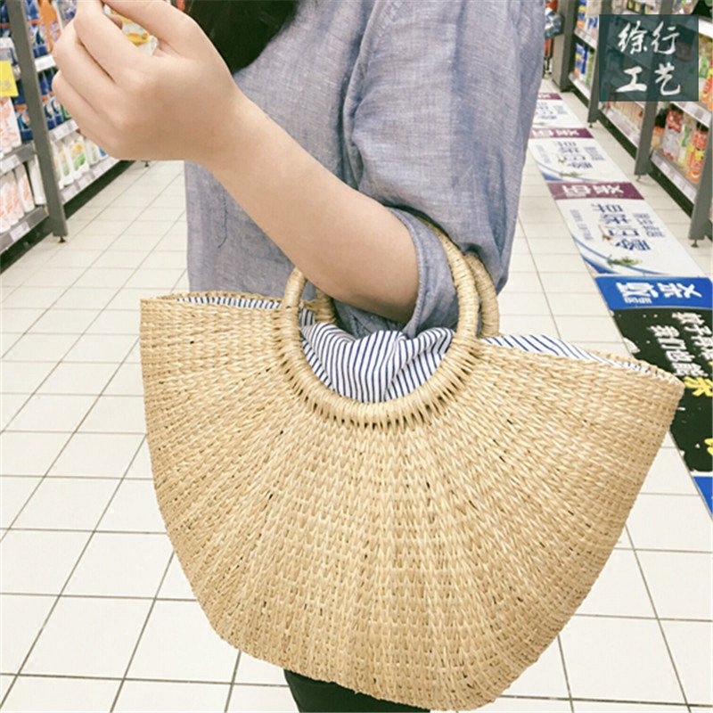徐行工艺条纹草编包ins同款半圆月亮包度假拍照沙滩夏天手提女包