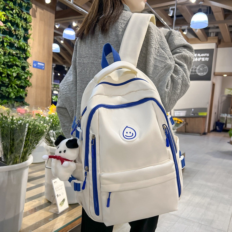 学生书包女初中生2023新款印花笑脸双肩包大容量简约中大学生背包