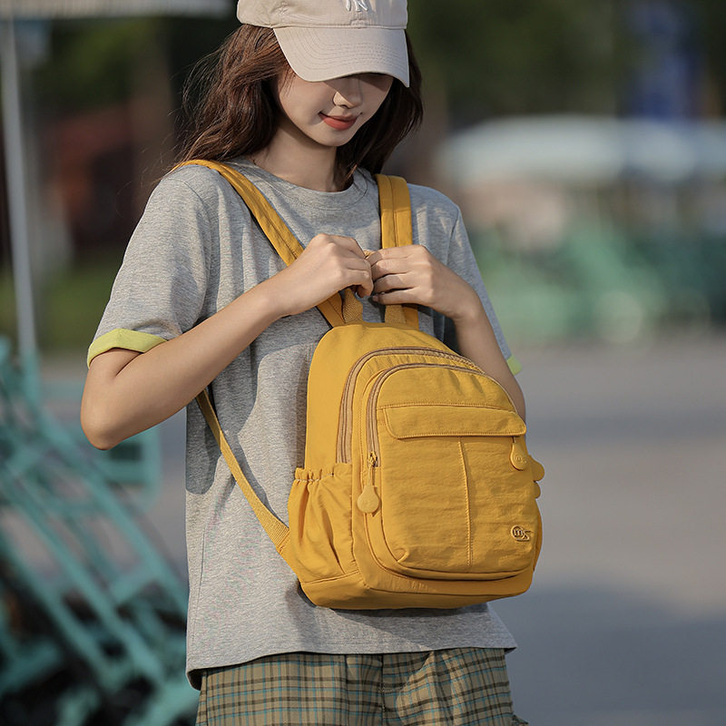 2026轻便防泼水布艺纯色清新少女游玩双肩背9.7寸IPAD伞便携小包