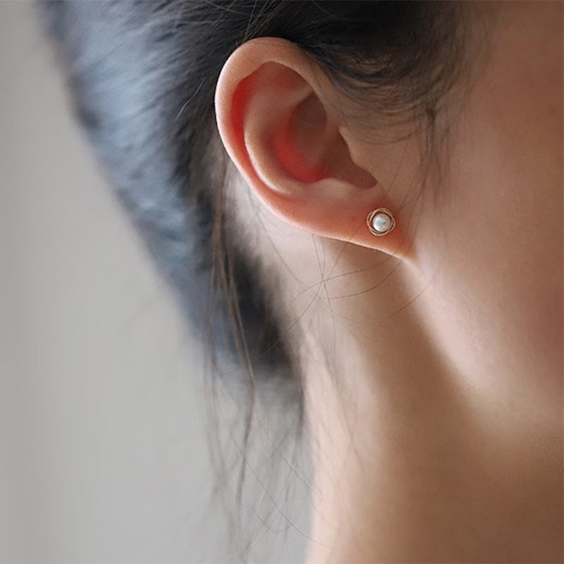 14K gold pearls surround the ear studs
