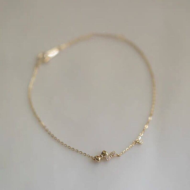14K gold double bow bracelet