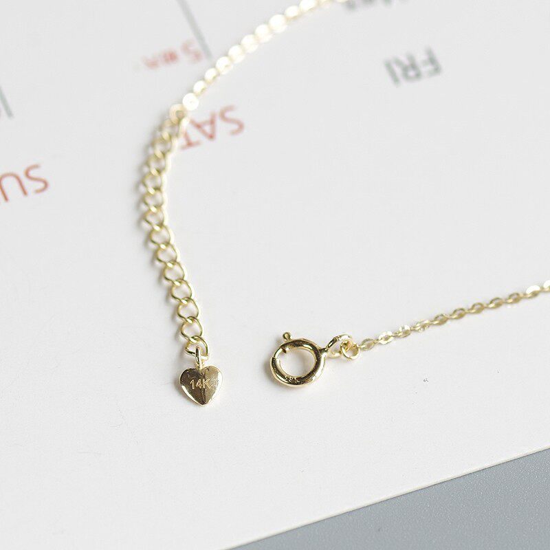 14K gold diagonal heart bracelet
