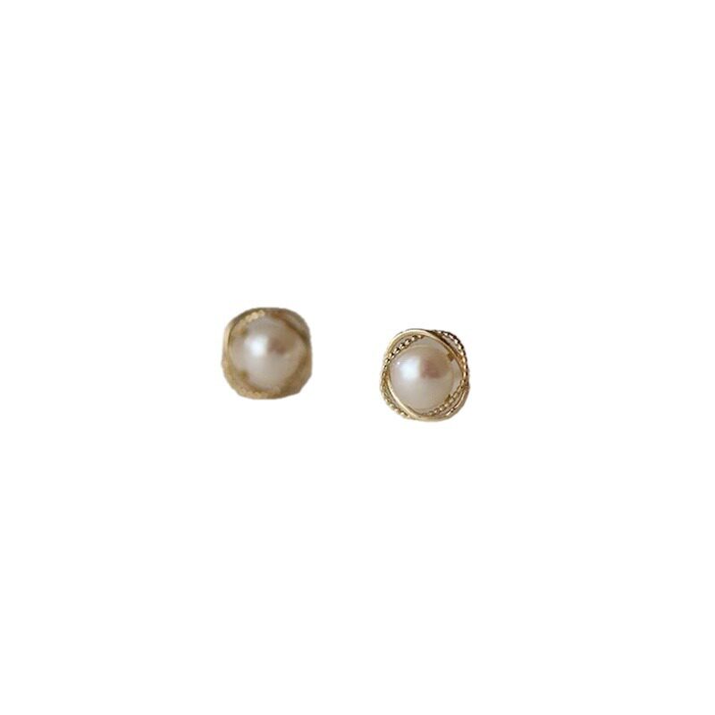 14K gold pearls surround the ear studs