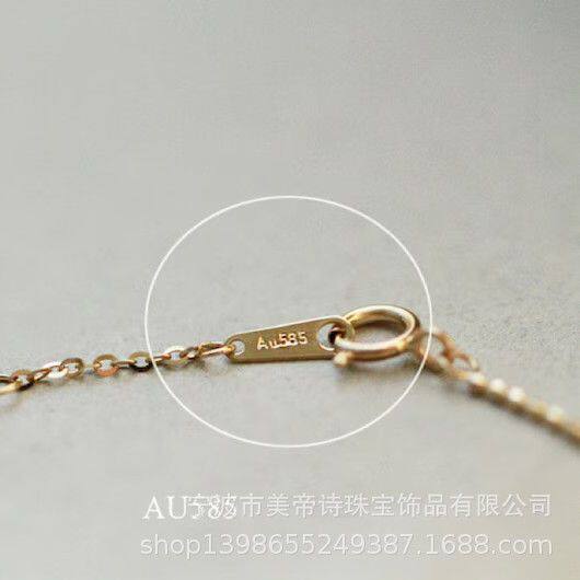 14K gold double bow bracelet