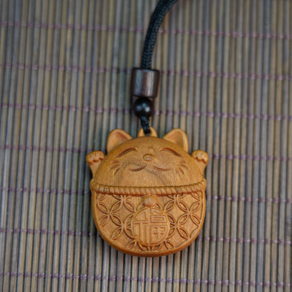 Thunderstruck Peach Wood Maneki-Neko Pendant - Natural Evil-Warding, Wealth-Attracting Talisman, Unisex Mascot