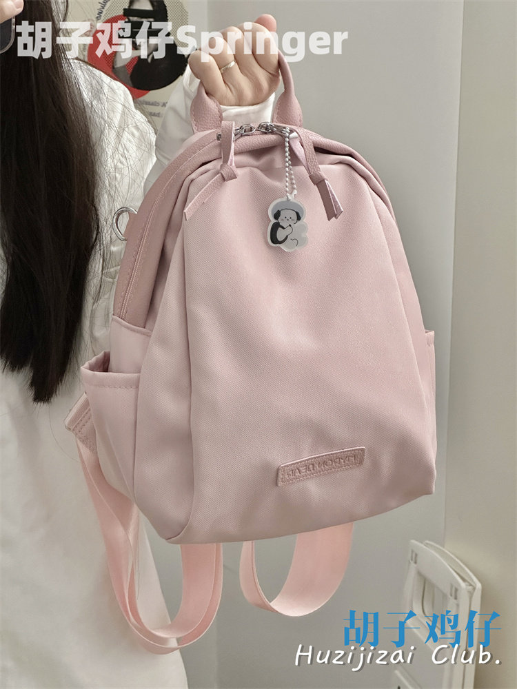 Good-looking girl student backpack