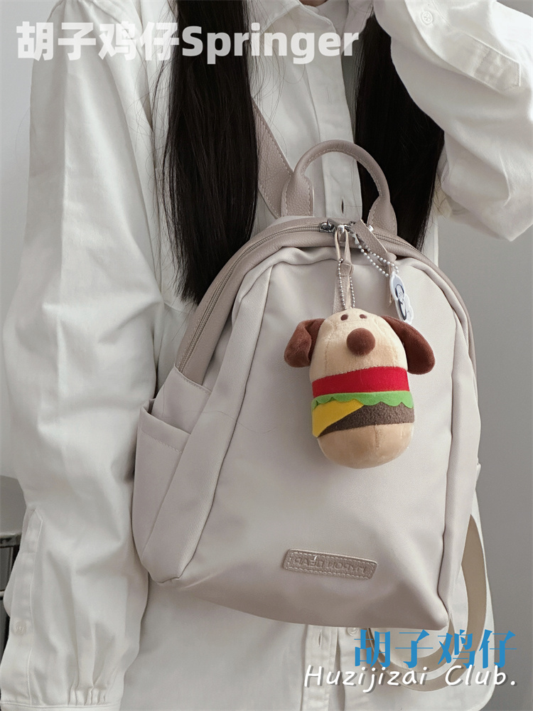Good-looking girl student backpack