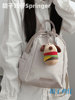 Good-looking girl student backpack