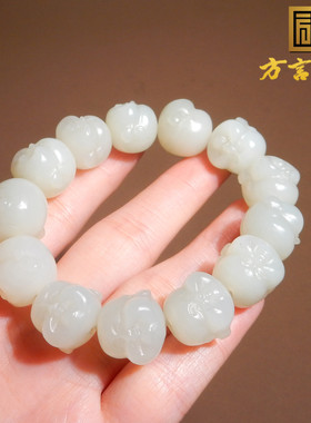 新疆且末料羊脂白玉精雕佛头手串