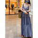 A V-neck suspender high-waist dress can be worn alone