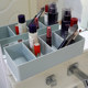 Divided storage box with adjustable partition distance