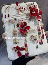 The Monarchs Home Bridal Ornament Red Green Collider with a small lantern and multiple sets of Chinese headwear