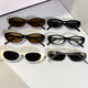 Punk-style cat-eye sunglasses with diamond letters and concave shape