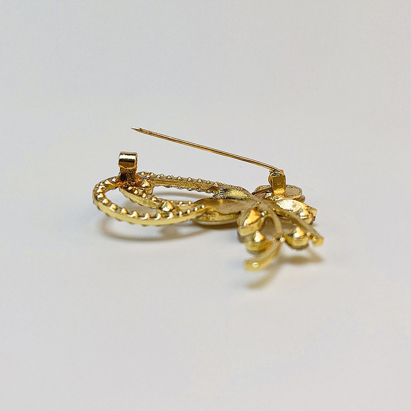 Korean high-end fashion rhinestone cat's eye orchid brooch corsage collar pin versatile clothing accessories scarf buckle wholesale