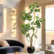 Decoration floor-standing potted plant indoor fake tree next to the sofa in the living room