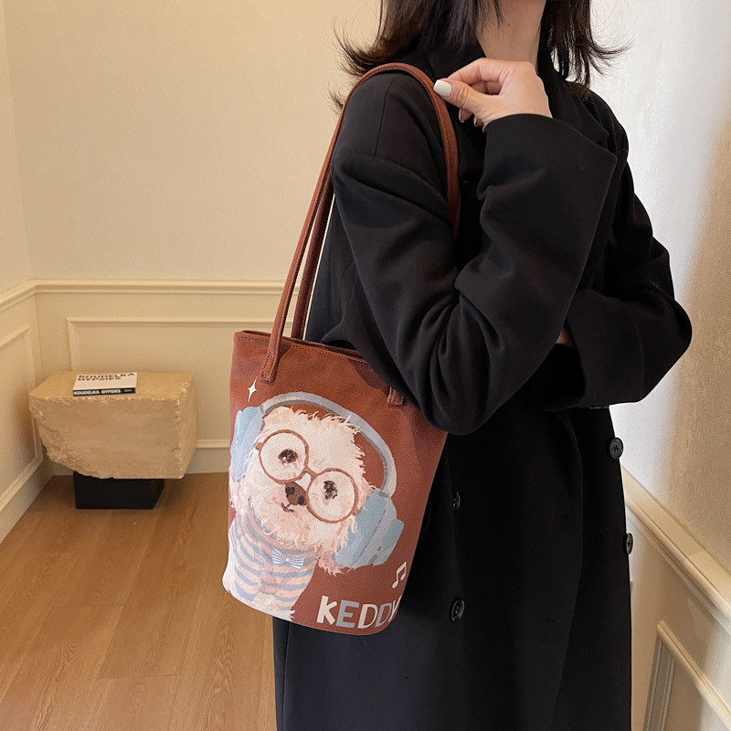 原创耳机小白布袋定制水桶包上班通勤设计感小众装书百搭手拎包,淘宝优惠券,粉丝福利购,淘宝优惠卷