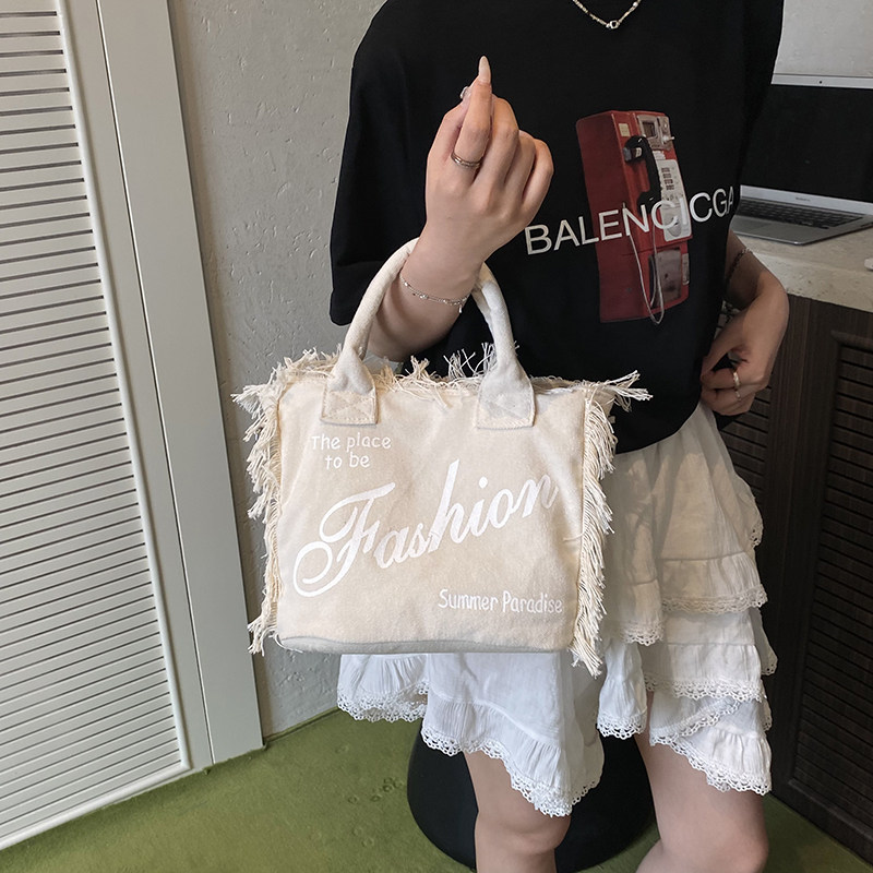 帆布包包2025新款秋冬韩版流苏时尚通勤包大容量手提包单肩斜挎包,淘宝优惠券,粉丝福利购,淘宝优惠卷