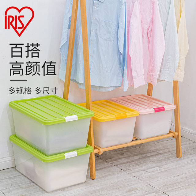 Alice organizes large transparent storage box with cover