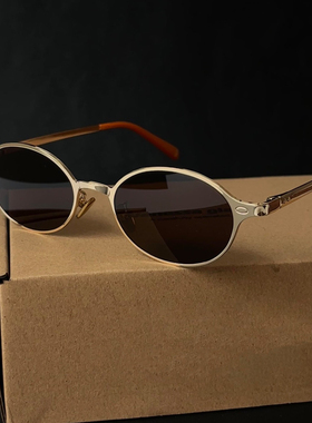 黑茶镜片金丝边椭圆形太阳眼镜